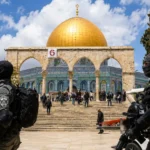 Security personnel stand guard near the Al-Aqsa Mosque compound in Jerusalem.