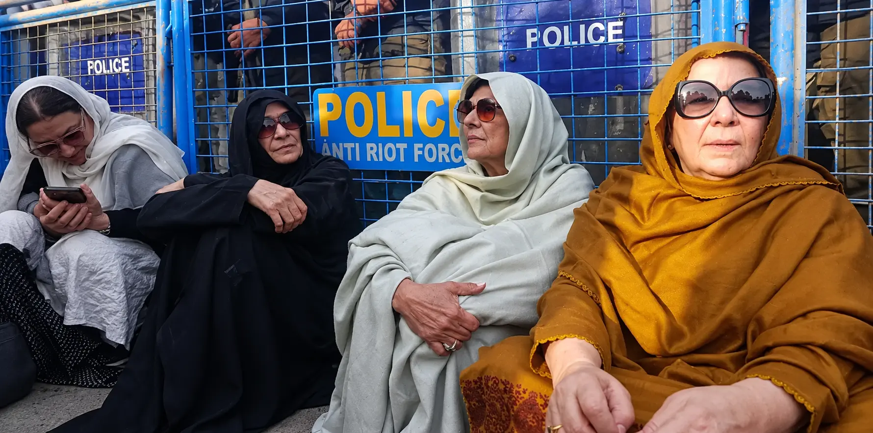 Imran Khan’s sisters and lawyers wait outside Adiala Jail after being denied permission to meet the former prime minister.
